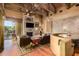 Living room with stone fireplace, hardwood floors, and a built-in bar at 3831 E Huber St, Mesa, AZ 85205