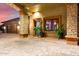 Evening view of home's exterior with stone columns and walkway at 3831 E Huber St, Mesa, AZ 85205