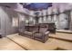 Spacious home theater with tiered seating and movie posters at 3831 E Huber St, Mesa, AZ 85205