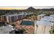 Aerial view of apartment community with tennis courts and mountain view at 7930 E Camelback Rd # 506, Scottsdale, AZ 85251