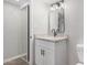 Updated bathroom with granite countertop, modern vanity, and large mirror at 7930 E Camelback Rd # 506, Scottsdale, AZ 85251