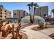 Enclosed pool area with lounge chairs and surrounding landscaping at 7930 E Camelback Rd # 506, Scottsdale, AZ 85251