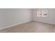 Bright bedroom with large window and wood-look floors at 7930 E Camelback Rd # 506, Scottsdale, AZ 85251