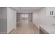 Bright living room with wood-look floors and access to balcony at 7930 E Camelback Rd # 506, Scottsdale, AZ 85251