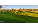 Expansive green golf course with shadows, showing a well-maintained area at 7930 E Camelback Rd # 506, Scottsdale, AZ 85251