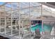 Relaxing pool area with lounge chairs under a glass enclosure at 7930 E Camelback Rd # 506, Scottsdale, AZ 85251