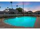 Relaxing community pool at twilight, perfect for evening swims at 7113 E Mcdonald Dr, Paradise Valley, AZ 85253