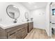 Modern bathroom with dual vanities and plenty of storage at 7113 E Mcdonald Dr, Paradise Valley, AZ 85253