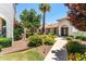 Landscaped walkway leads to charming Spanish-style homes at 7113 E Mcdonald Dr, Paradise Valley, AZ 85253