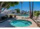 Community pool and spa with surrounding landscaping at 7113 E Mcdonald Dr, Paradise Valley, AZ 85253