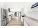 Modern kitchen with stainless steel appliances and light-colored cabinets at 7113 E Mcdonald Dr, Paradise Valley, AZ 85253