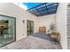 Private patio with pergola, bistro table, and chairs at 7113 E Mcdonald Dr, Paradise Valley, AZ 85253