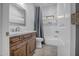 Clean bathroom with a tub, shower, and dark wood vanity at 47616 N 23Rd Dr, New River, AZ 85087