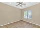 Well-lit bedroom with ceiling fan and wood-look flooring at 30200 N Desert Willow Blvd, San Tan Valley, AZ 85143