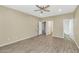 Spacious bedroom with ceiling fan and wood-look flooring at 30200 N Desert Willow Blvd, San Tan Valley, AZ 85143