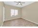 Bright bedroom with wood-look flooring and window coverings at 30200 N Desert Willow Blvd, San Tan Valley, AZ 85143