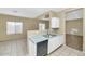 Kitchen boasting white cabinets and black appliances at 30200 N Desert Willow Blvd, San Tan Valley, AZ 85143