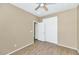 Bedroom with sliding door closet and wood-look flooring at 30200 N Desert Willow Blvd, San Tan Valley, AZ 85143