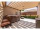 Relaxing hot tub area with pergola and patio at 1920 E Schooner Ct, Gilbert, AZ 85234
