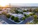 Aerial view of a house and neighborhood at sunset at 1920 E Schooner Ct, Gilbert, AZ 85234