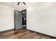 Simple bedroom with hardwood floors and neutral walls at 1920 E Schooner Ct, Gilbert, AZ 85234