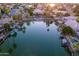 Aerial view of waterfront property with boats and calm water at 1920 E Schooner Ct, Gilbert, AZ 85234