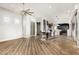 Open concept dining room with wood floors and views into the modern kitchen at 1920 E Schooner Ct, Gilbert, AZ 85234
