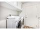 Laundry room with washer, dryer, and cabinets at 1920 E Schooner Ct, Gilbert, AZ 85234