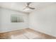 Simple bedroom with window and ceiling fan at 1920 E Schooner Ct, Gilbert, AZ 85234