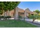 Single-story home with landscaped yard and covered entryway at 1920 E Schooner Ct, Gilbert, AZ 85234