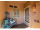 Inviting entryway with a bench, wall decor, and a security screen door at 11500 E Cochise Dr # 2011, Scottsdale, AZ 85259