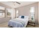 Bright bedroom with a queen-size bed and ample natural light at 11500 E Cochise Dr # 2011, Scottsdale, AZ 85259