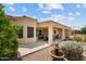 Covered patio with seating area, fountain, and desert landscaping at 550 S Lincoln St, Wickenburg, AZ 85390