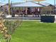 Community playground with covered pavilion and play structures at 16214 W Questa Dr, Surprise, AZ 85387
