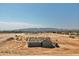 New construction home with mountain views and surrounding desert landscape at 22329 W Gamble Ln, Wittmann, AZ 85361