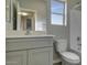 Bathroom boasts a vanity with a modern sink and a toilet at 22329 W Gamble Ln, Wittmann, AZ 85361