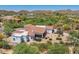 Aerial view of a luxurious home with mountain views and a large backyard at 6832 E Stevens Rd, Cave Creek, AZ 85331