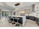 Modern kitchen with a large island, stainless steel appliances, and white quartz countertops at 6832 E Stevens Rd, Cave Creek, AZ 85331