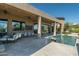 Luxury pool and patio area with seating and mountain views at 9673 E Oberlin Way # 15, Scottsdale, AZ 85262
