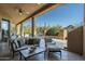 Relaxing patio with comfortable seating overlooking the pool and desert landscape at 9673 E Oberlin Way # 15, Scottsdale, AZ 85262