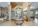 Open living area with high ceilings, stone walls, and large windows at 9673 E Oberlin Way # 15, Scottsdale, AZ 85262