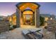 Elegant home exterior with a grand entrance and inviting patio at 9673 E Oberlin Way # 15, Scottsdale, AZ 85262
