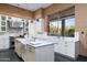 Gourmet kitchen with island, stainless steel appliances, and marble countertops at 9673 E Oberlin Way # 15, Scottsdale, AZ 85262
