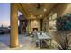 Spacious outdoor patio with fireplace and dining area, perfect for gatherings at 9673 E Oberlin Way # 15, Scottsdale, AZ 85262