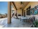Outdoor patio with seating area, fireplace, and built-in grill at 9673 E Oberlin Way # 15, Scottsdale, AZ 85262
