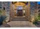 Stunning stone exterior with a grand entrance and arched entryway at 9673 E Oberlin Way # 15, Scottsdale, AZ 85262