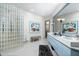 Modern bathroom with glass block shower and light blue vanity at 9673 E Oberlin Way # 15, Scottsdale, AZ 85262