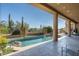 Inviting pool area with a spacious patio and stunning desert views at 9673 E Oberlin Way # 15, Scottsdale, AZ 85262