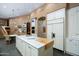 Modern kitchen with center island, breakfast area, and high end appliances at 9673 E Oberlin Way # 15, Scottsdale, AZ 85262