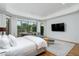 Luxurious main bedroom features a sitting area and large windows at 9673 E Oberlin Way # 15, Scottsdale, AZ 85262